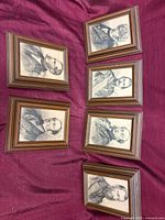 All six framed portrait prints displayed together on burgundy cloth