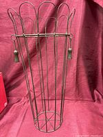 Full view of metal umbrella stand showing scalloped rim and height