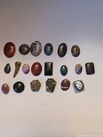 All 19 cabochons laid out showing shapes and colours