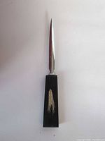 Full view of letter opener showing blade and handle