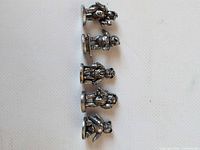 All five pewter teddy bear figurines lined up