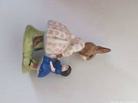 Oblique view of Dollie Bunnykins figurine showing overall form, colors, and detailing