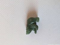 Top view of small green jade bear figurine