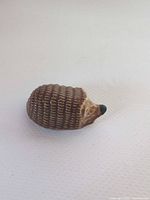 Side view of ceramic hedgehog figurine