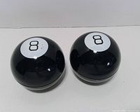 Top view showing both Magic 8 Balls with number 8 decals