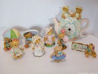 Group shot showing all nine Cherished Teddies pieces