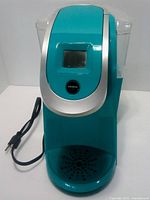 Front view of Keurig K250 showing control panel, drip tray and power cord