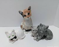 Four cat figurines group shot