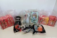 Front view showing all six sealed Happy Meal toys aligned