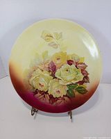 Front view of floral Bavaria charger plate on stand