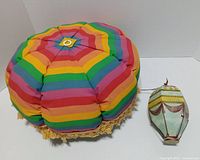 Rainbow cushion and painted balloon together