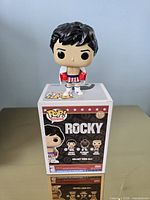 Figure displayed on top of box showing back panel graphics