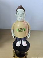 Front view of Ed vinyl figure on base