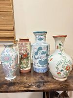 Group view of all four vases on tabletop