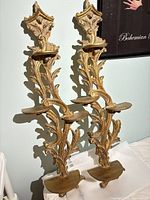 Full view of both matching gold wall shelves