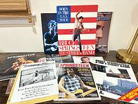 Group shot of all Bruce Springsteen magazines, tour program and booklets