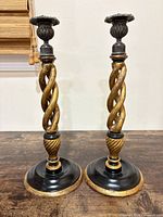 Both candlesticks front view showing spiral design and bases