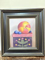 Full view of framed still life painting