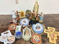 Full lot overview displaying statues, crosses, plaques, rosaries and accessories