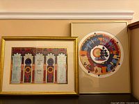 Both framed artworks side by side showing scale and frames