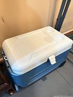 Blue Igloo wheeled cooler showing overall form and lid