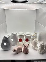 All six pairs of salt and pepper shakers in light box