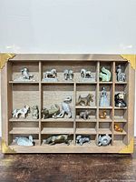 Full view of wooden display case with all figurines