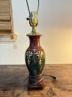 Full view showing ceramic body, wood base, cord