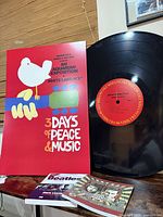 Bruce Springsteen wall record, Woodstock poster, Beatles book, Dylan/Cash book displayed together