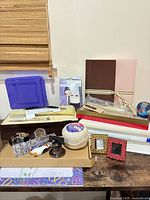 Overview of assorted office supplies and desk items on table