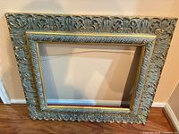 Front view of ornate gold frame showing full dimensions