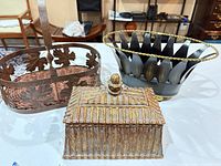 Group shot of three metal decorative pieces