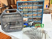 Overall lot showing organizer, driver set case, drill bits, pliers, clamp tool, push pins