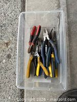 Top view of all tools inside clear bin