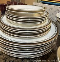 Stacked plates showing variety of sizes and border pattern