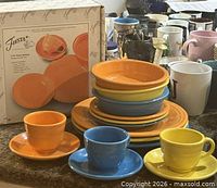 All Fiesta dishes stacked with cups and original Fiesta box visible