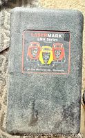Black textured carry case with LaserMark LMH series graphic