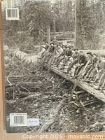 Back cover showing continued logging photograph, barcode, and price sticker