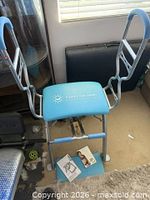 Overall view of Pilates Pro Chair with sculpting handles attached and manuals on seat