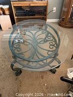 full view of glass top on wrought iron base