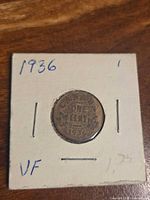 Front of coin in 2×2 holder showing reverse design and date 1936.