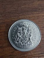 Reverse of 1977 Canada 50-cent coin showing Coat of Arms