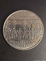 Reverse side showing Fathers of Confederation design and inscriptions