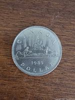 Reverse side showing Voyageur canoe design, date, denomination