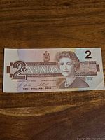 Front of 1986 $2 Canadian banknote showing Queen Elizabeth II, denomination and crest