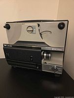 Full front view of Bell & Howell 8mm Multi Motion projector showing overall condition, reel arms and control panel