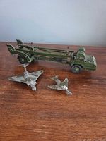 Group shot of launcher truck and two jets