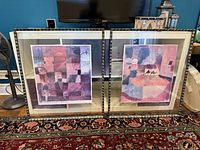 Both framed prints side by side showing artwork and frames