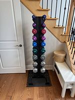 Front view of rack with all dumbbells