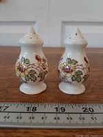 Front view of both shakers with ruler for scale